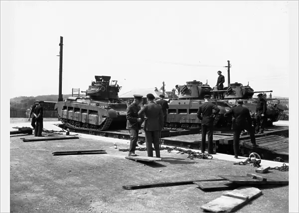 Tanks being loaded onto Rectank flat wagons, c. 1940