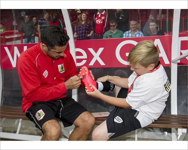 Bristol City's Scott Murray Signs Young Fan's Football Boot at Ashton Gate