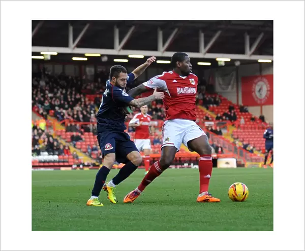Bristol City's Jay Emmanuel-Thomas Fends Off Milan Lalkovic in Sky Bet League One Clash