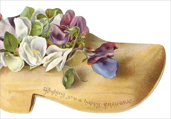 Flowers in a wooden clog-shaped Christmas card