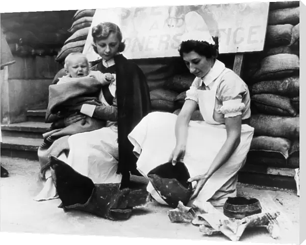 Nurses from Great Ormond Street Hospital examine bomb
