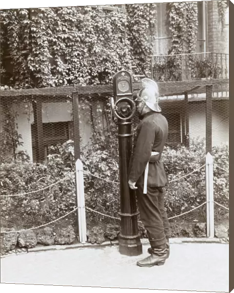 Firefighter using telephone point in street