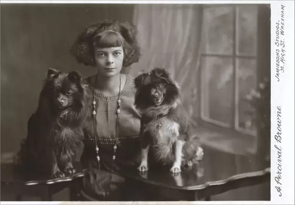 Young woman with two little dogs