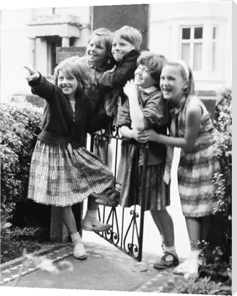 Group of children at a gate, Balham, SW London