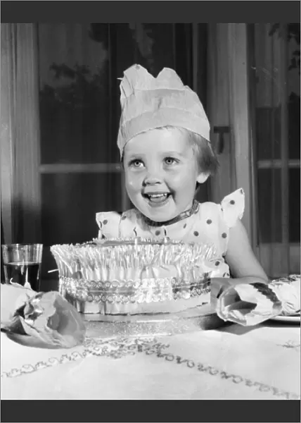 Little girl with Christmas cake