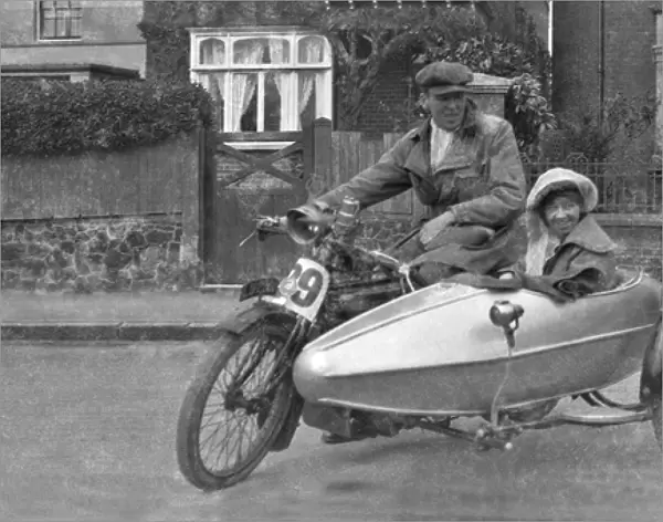 Couple with motorbike and sidecar