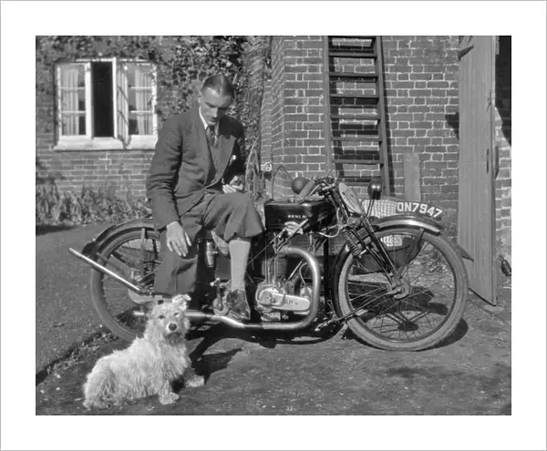 Man on a motorbike with a dog
