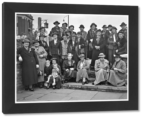 Group photo of women in hats and coats
