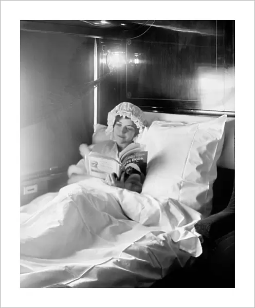 Woman reading in an Electric-lighted sleeper berth