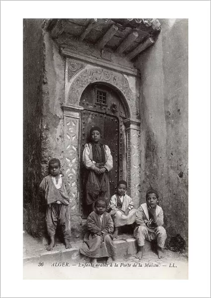 Arab children in a house doorway, Algiers, Algeria