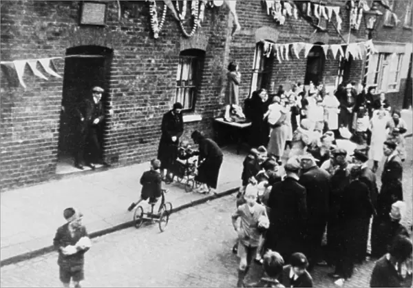 Aerial view, people at a street party with bunting