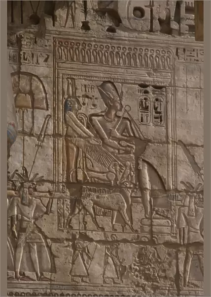 Temple of Ramses III. Ramses III wearing Khepresh being carr