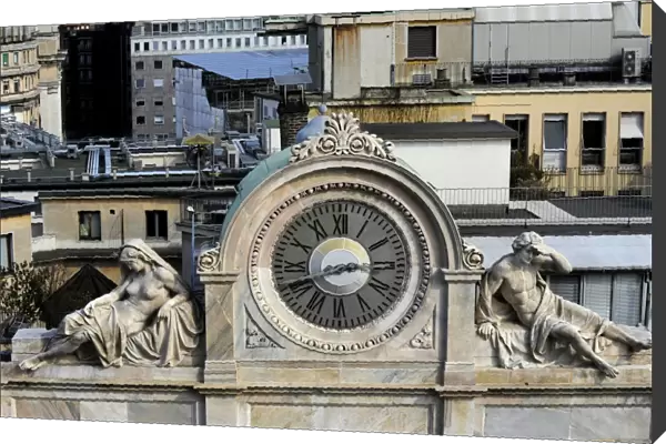 Italy. Milan. Clock decorated with two statues