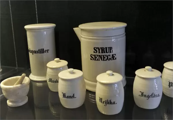 Pharmaceutical containers with inscriptions, and mortar. pha