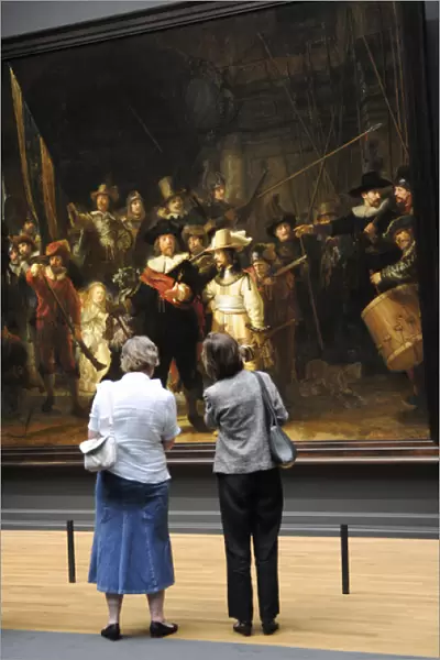 Women looking The Night Watch, painting by Rembrandt (1606-1