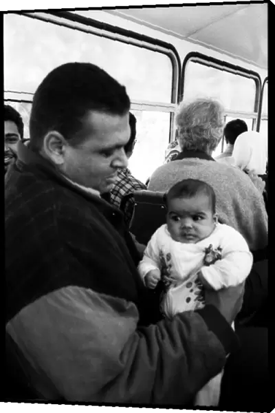Man and baby on bus Alexandria, Egypt