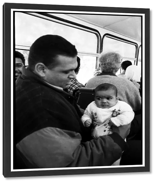 Man and baby on bus Alexandria, Egypt