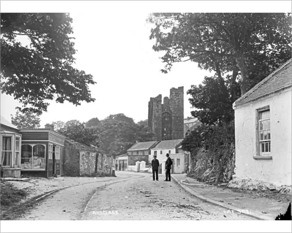 Ardglass - a view of the town looking up to the Castle with two men on the road