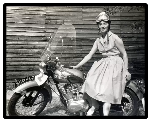 Woman on 1950s Triumph motorcycle