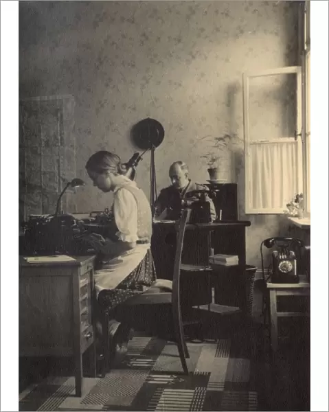 Secretary and soldier in an office, Braunschweig, Germany