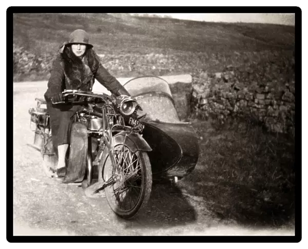 Lady sitting on 1920 Sunbeam 500 motorcycle