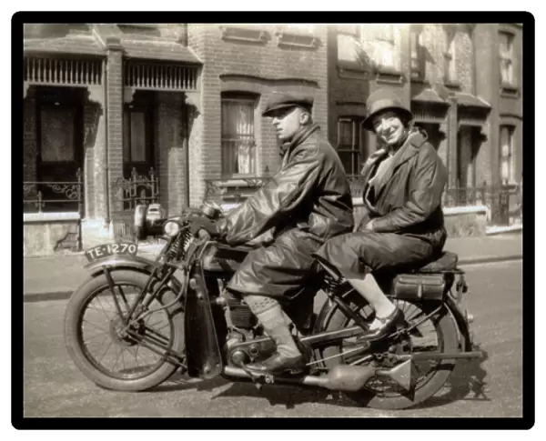 Man & woman on their 1928  /  9 New Imperial motorcycle