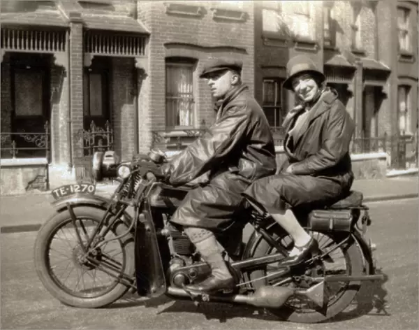 Man & woman on their 1928  /  9 New Imperial motorcycle