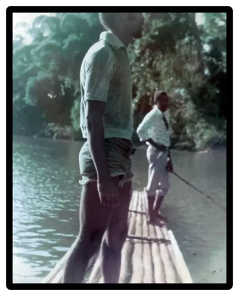 British Caribbean man standing on raft on the Rio Grande, Jam