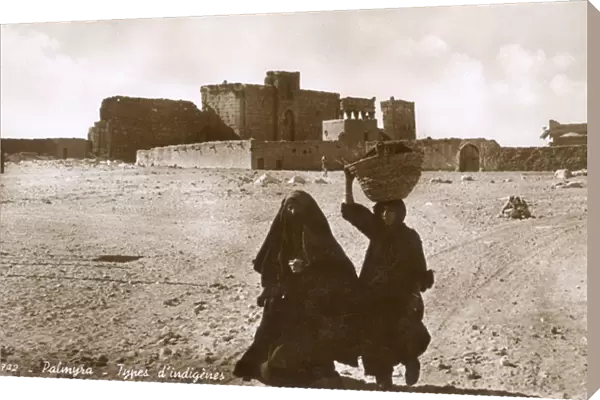 Women in front of the site of Palmyra, Syria