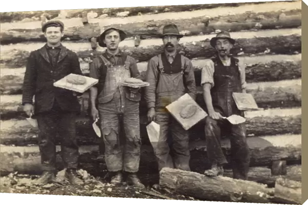 Four men with trowels and cement on boards, USA