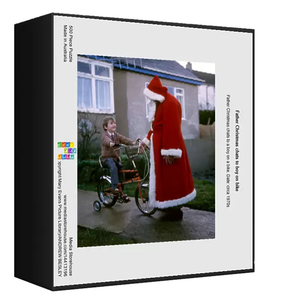 Father Christmas chats to boy on bike
