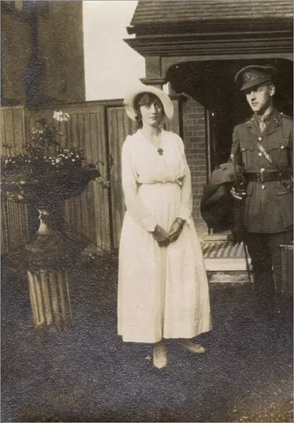 Soldier with fiancee outside her home, WW1