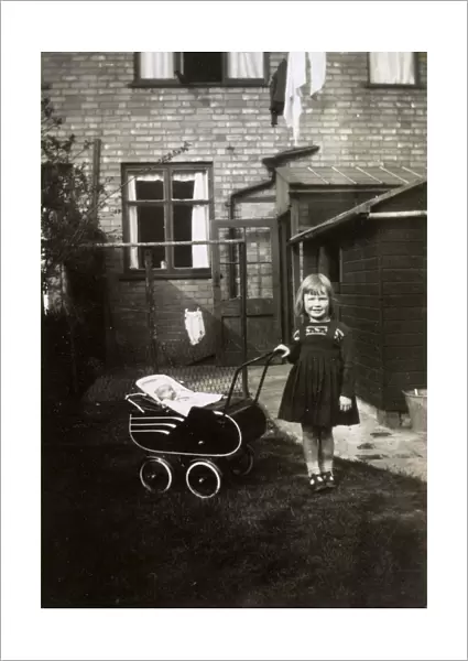 1940s - Young girl with her toy pram