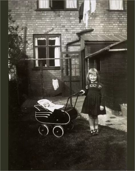 1940s - Young girl with her toy pram