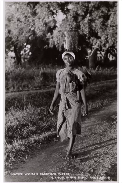 Zambia (Northern Rhodesia) - Woman carrying water