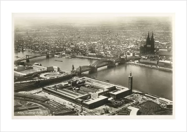 Aerial View of Cologne, Germany, featuring the Hohenzollern Bridge over the River Rhine