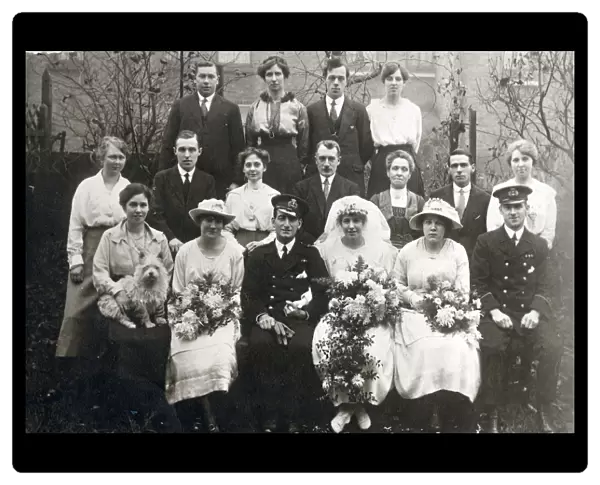 A post WW1 group weddig photograph, taken in a suburban back garden. Date: 1919