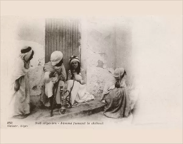 Women smoking a Chibouk Pipe - Southern Algeria