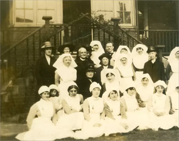 Formal group of nurses, older ladies, churchman