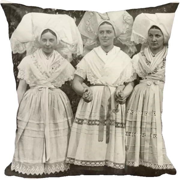 Three German bridesmaids in national costume, with elaborate hand-embroidered