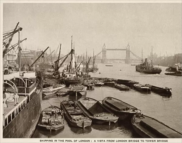 Shipping on the River Thames, London, view from London Bridge looking towards Tower