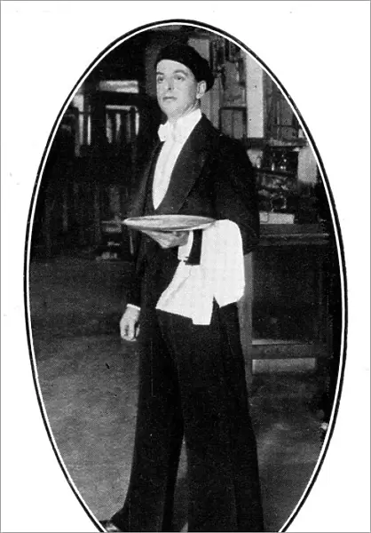 Waiter wearing beret and Oxford bags, 1926