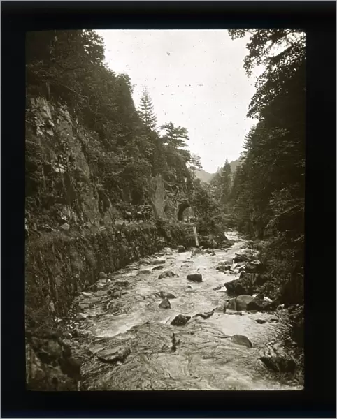 Sepia image of river, gorge and horse drawn cart