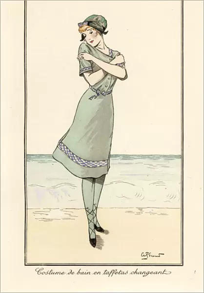 Woman on beach in swimming costume in two-tone taffeta