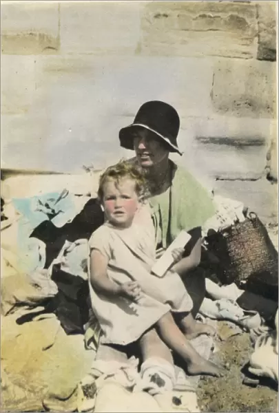 A mother and child on the beach at Bognor Regis. Date: 1920s