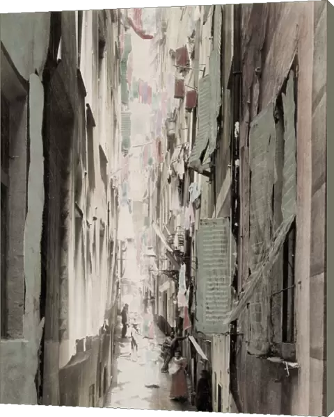 Narrow street, washing hanging upper windows, Italy