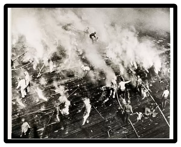WW II - crew of USS Intrepid aircraft carrier put out fires