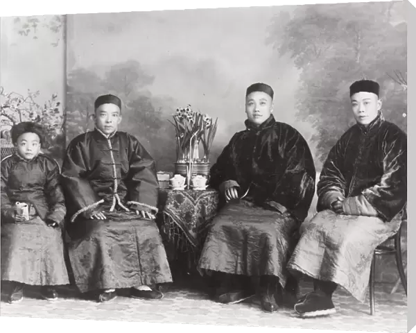 Group of affluent Chinese men with a boy