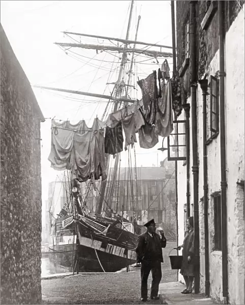 Port scene, with sailor and washing line, UK, 1930 s
