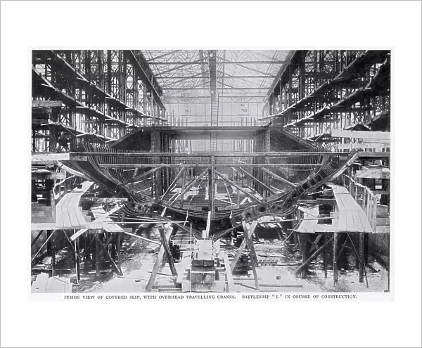 An inside view of a covered slip, with overhead travelling cranes at the Germania yard at Kiel, Germany. The ship being built is Battleship L'. Date: 1902